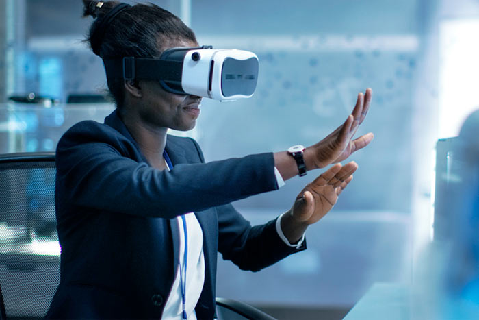 woman wearing virtual reality headset woman wearing VR headset