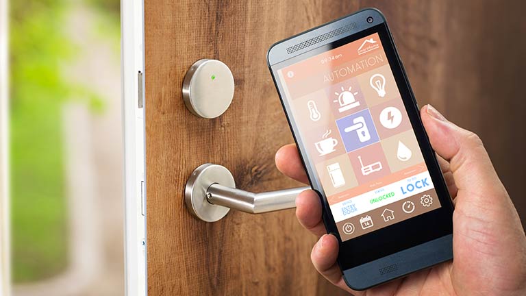 Smartphone held next to locked door