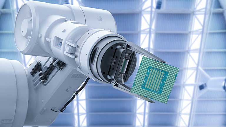 robotic hand holding a microchip