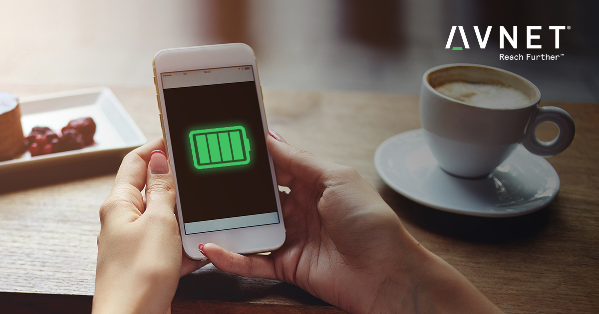 person holding smartphone on coffee table