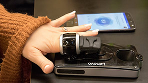 Smartphone with medical finger cuff attachment Woman using smartphone equipped with finger cuff to monitor vital signs