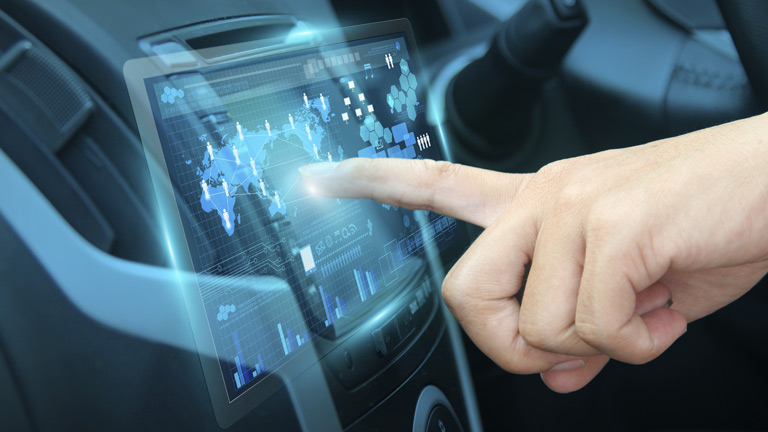 hand navigating smart car dasboard