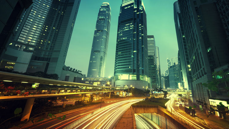 night time cityscape with fast-moving traffic