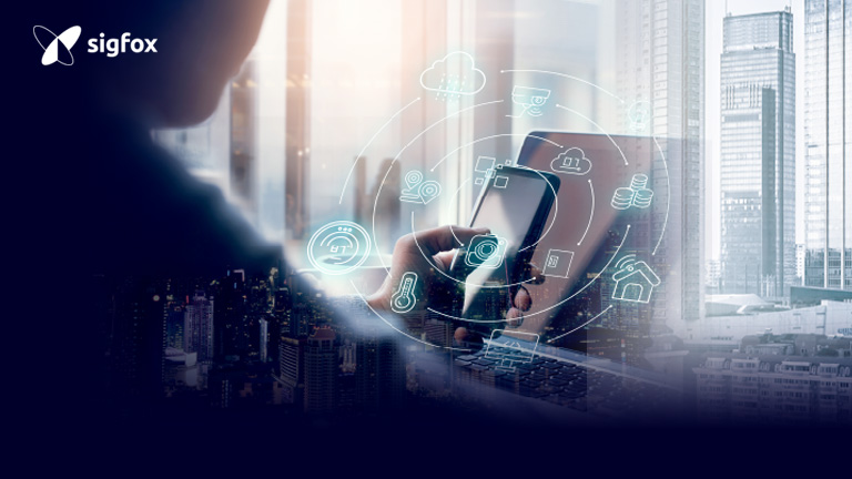 person looking at smartphone with IoT icons overlay