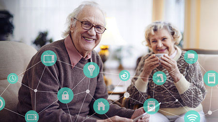 senior couple having tea with green IoT icons overlay