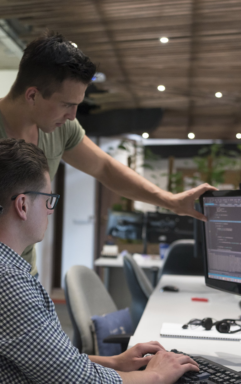two office workers discussing computer screen contents