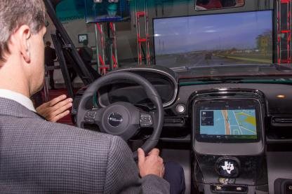 Man sitting in advanced electric car