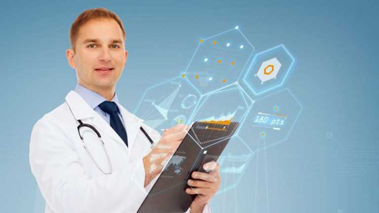A male nurse writing on a clipboard